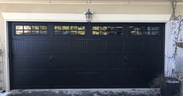 Black Garage Door Styles That Complement a White House Exterior
