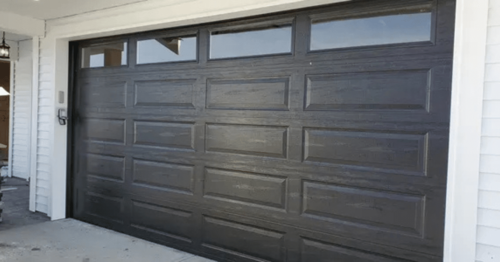 Make Your White House Stand Out With a Black Garage Door